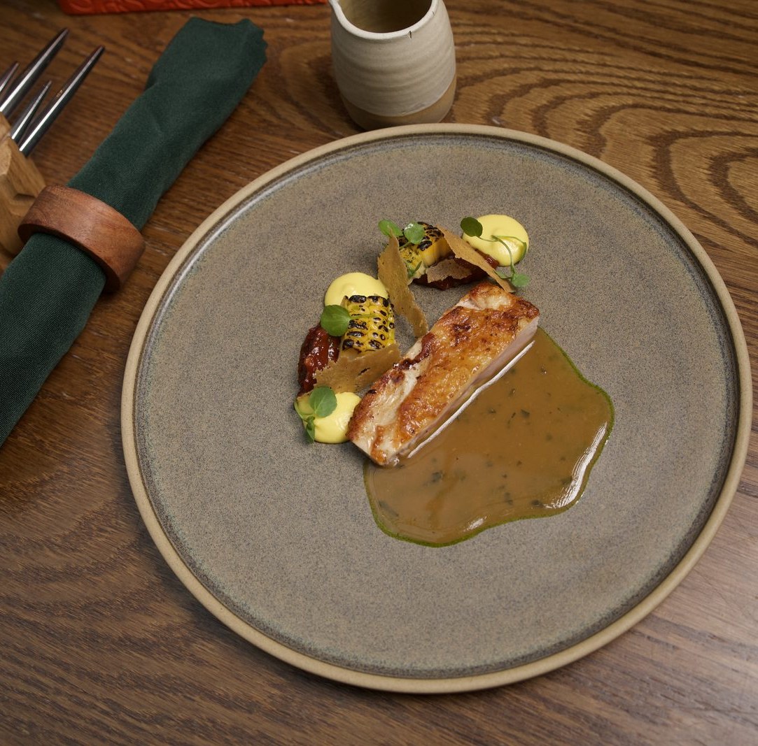 Cumbrian chicken with mushroom, charred hispi cabbage and black garlic jus