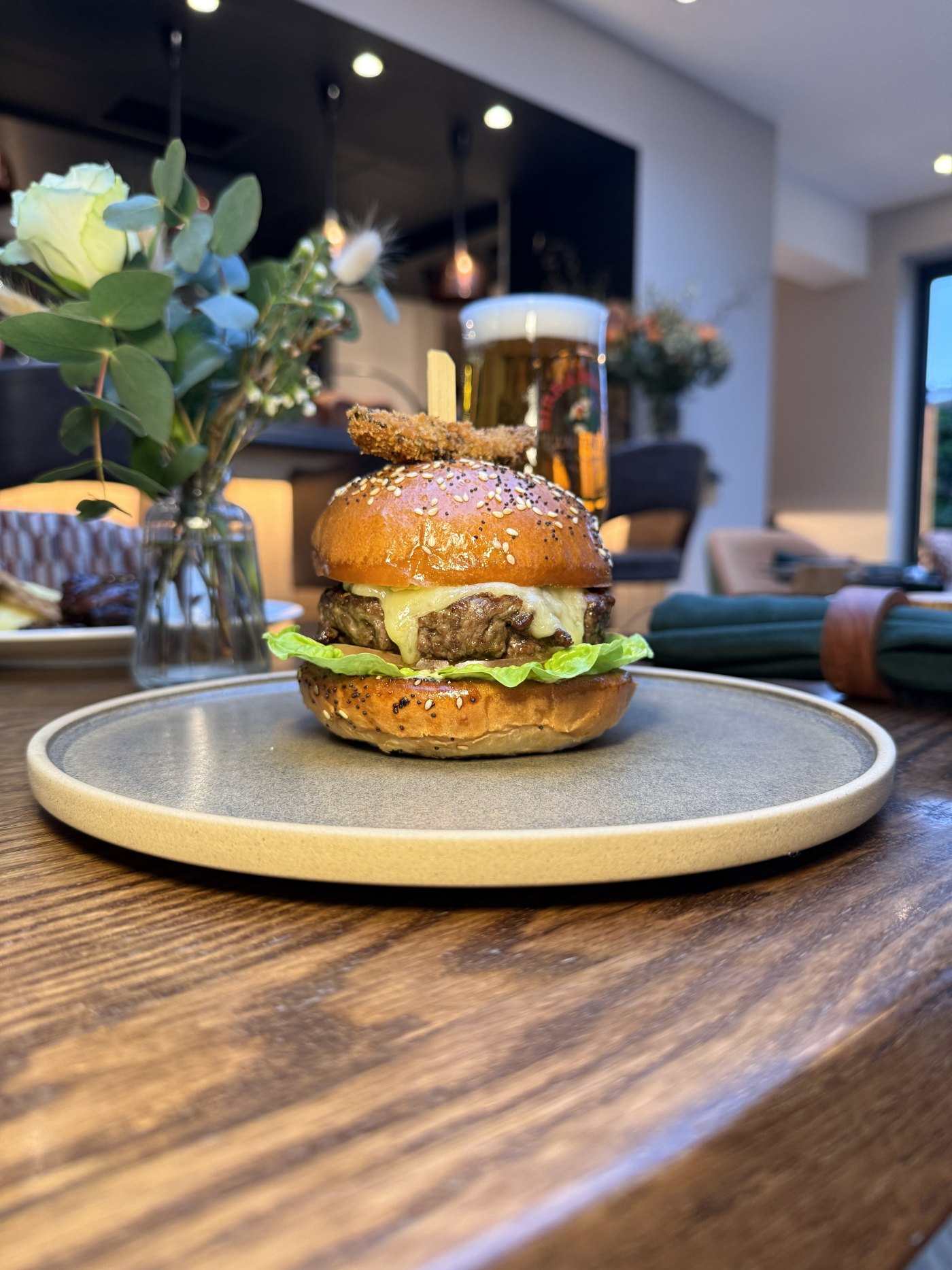 Beef and marrow burger with Lancashire cheese, gem lettuce and verde mayo