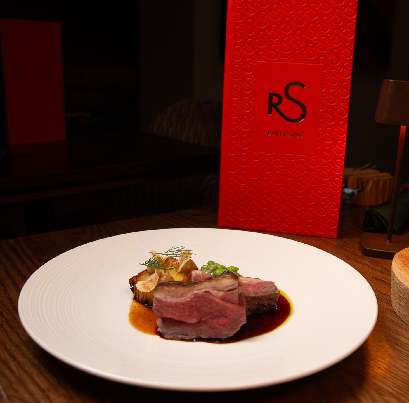 Sirloin of Hereford beef with ox cheek, Roscoff onion and potato pavé