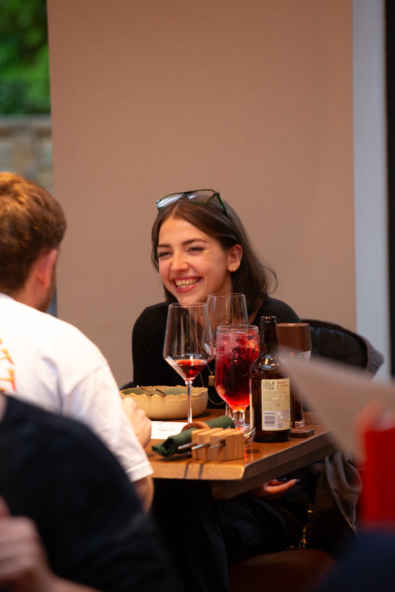 Guests enjoying drinks together at The Riverside